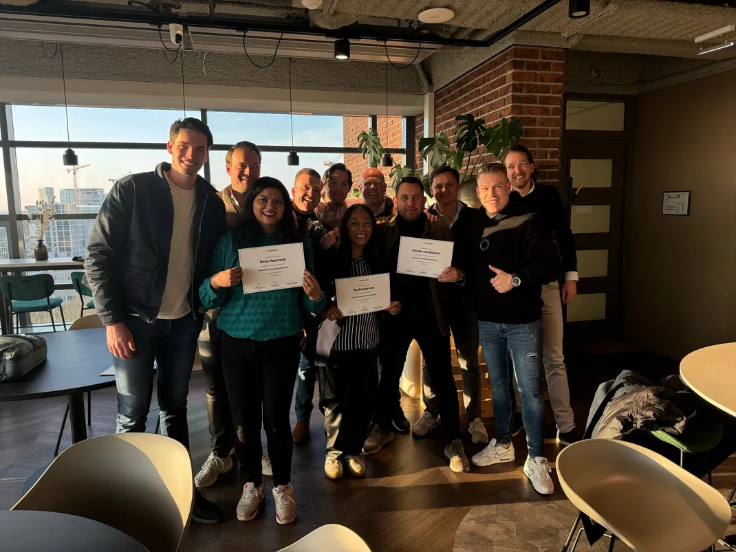 Participants holding their certificate after the AI workshop